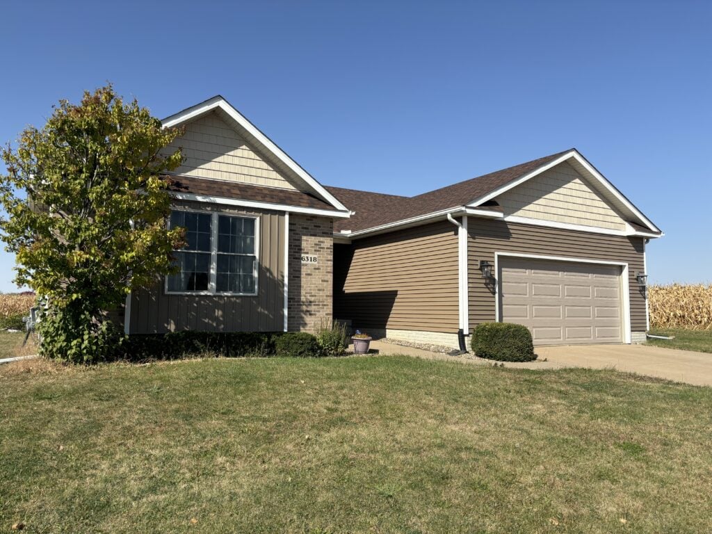 Professional siding installation on a residential home by a Silvis siding contractor
